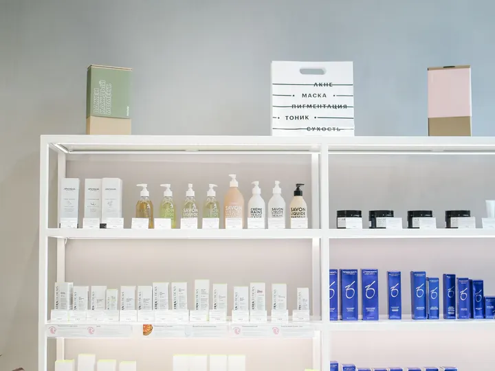 White retail display shelving stocked with beauty and haircare products