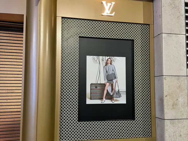 Louis Vuitton framed lightbox graphic installed at a store entrance