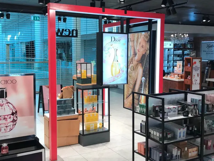 Dior fragrance graphics installed on a beauty concession